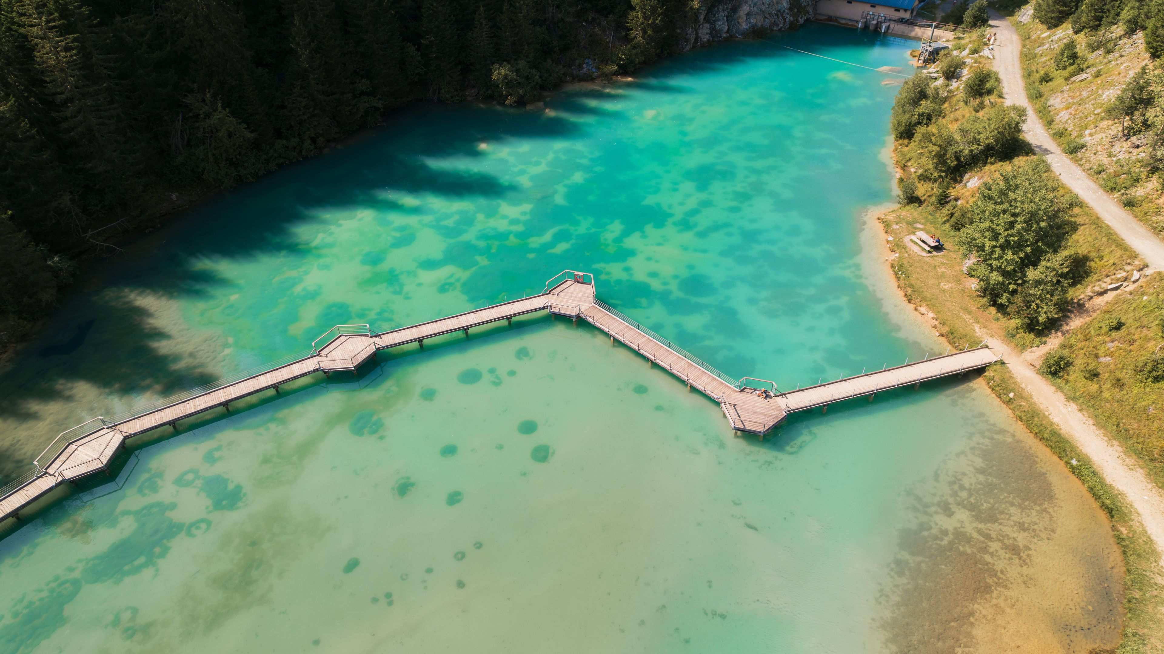Aerial photo by drone of the Rosière lake and the forest in Courchevel in the Tarentaise valley in France