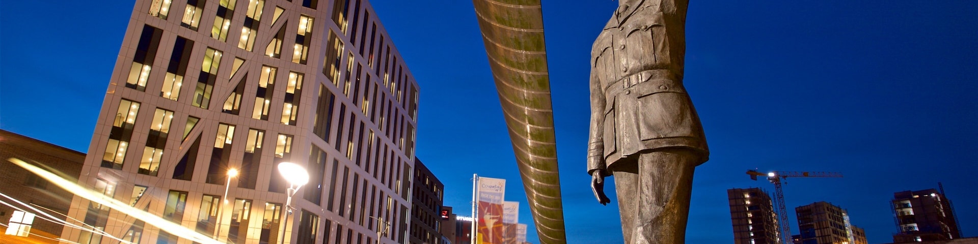 Coventry showing a statue or sculpture, a city and night scenes