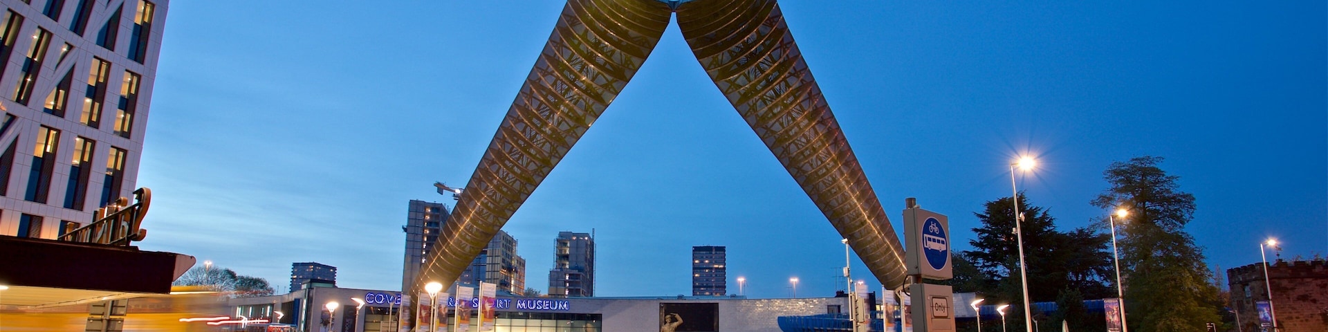 A city intersection with a distinctive bridge structure and a museum.
