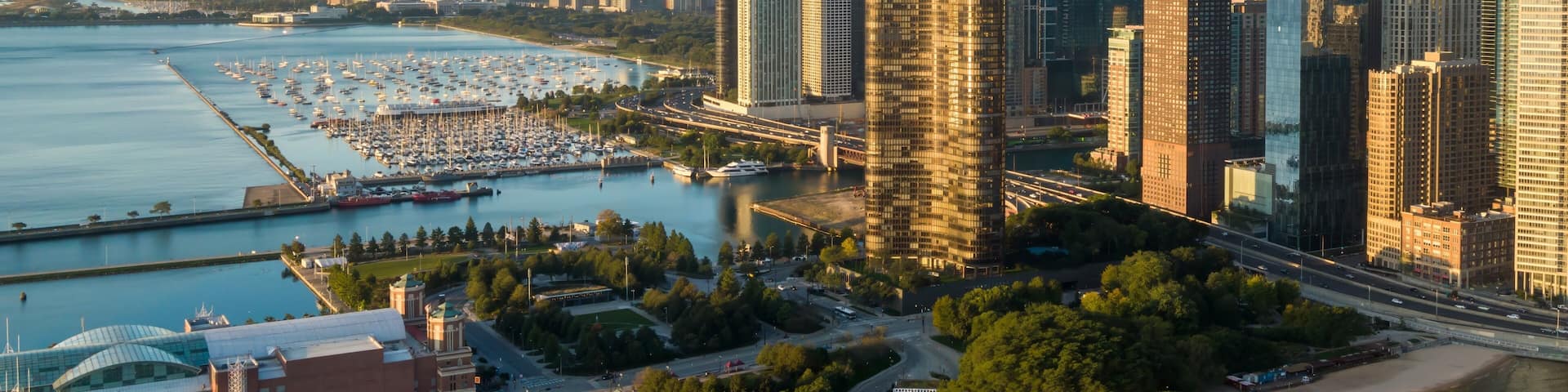Chicago skyline at sunrise, showcasing the city's iconic skyscrapers and marina. Beautiful aerial view. Downtown, Chicago, Illinois, United States Of America