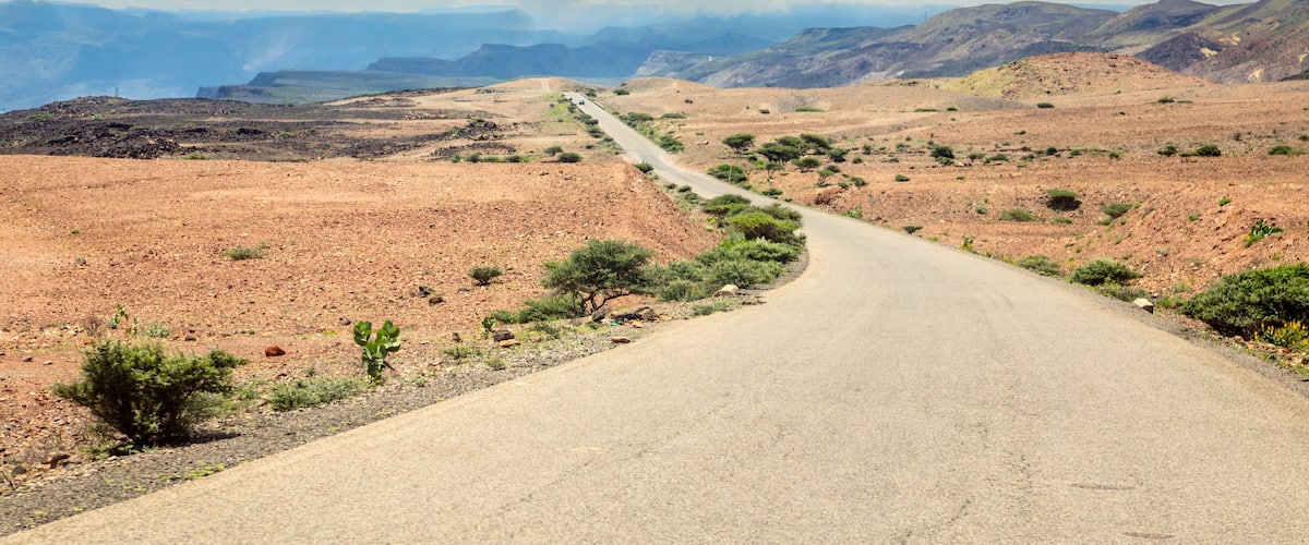 Asphalt road through djiboutian savanna, Arta region, Djibouti