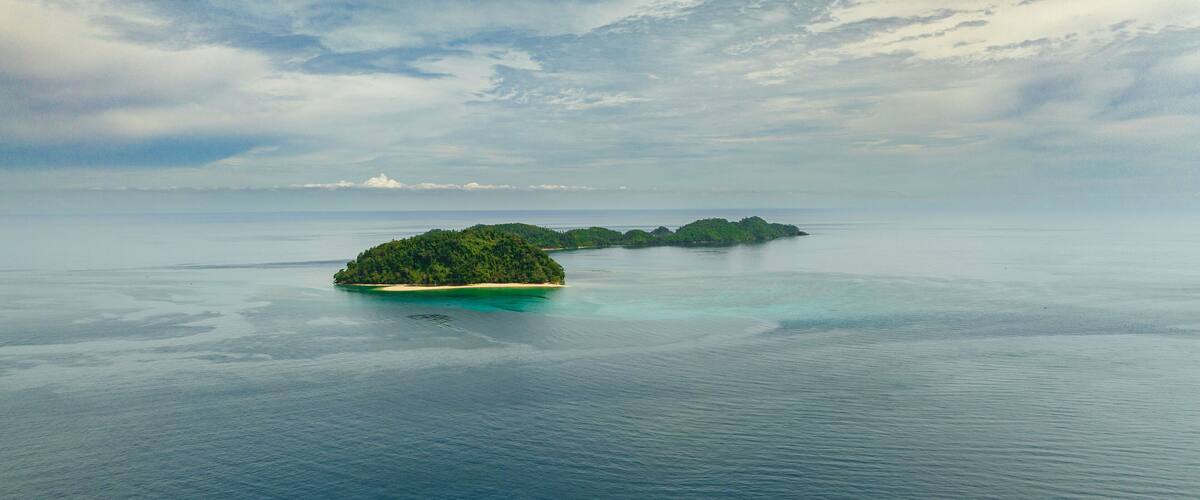 Tropical islands with beach and blue sea. Agutaya and Danjugan islands, Philippines.