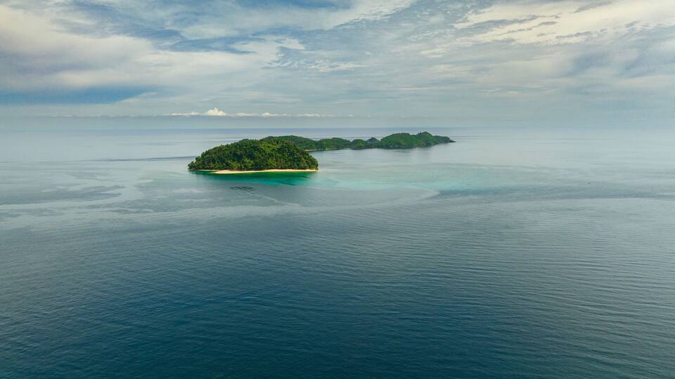 Tropical islands with beach and blue sea. Agutaya and Danjugan islands, Philippines.