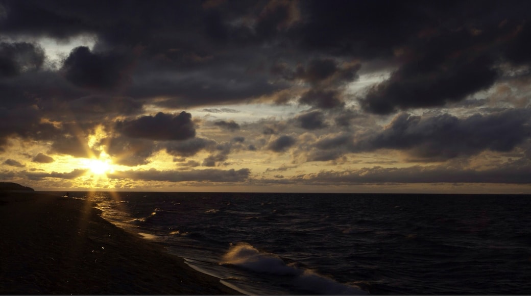 The calm after the storm as the sun rises on Lake Malawi on the Malawi side.