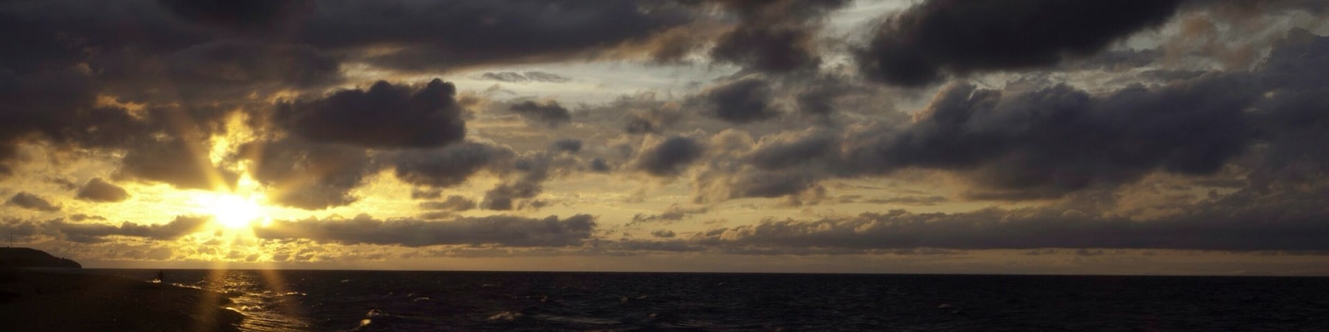 The calm after the storm as the sun rises on Lake Malawi on the Malawi side.