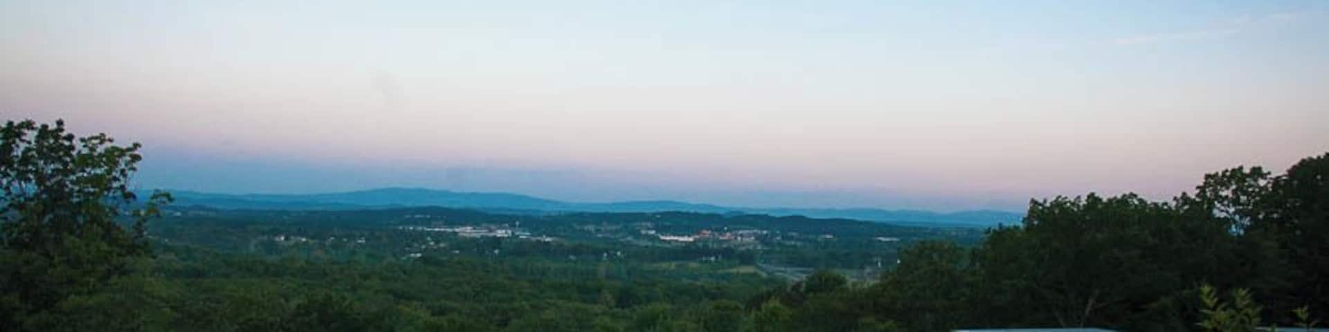 The Iris Inn, a luxury Shenandoah bed and breakfast, is the perfect base to explore Virginia's Blue Ridge mountains. Located 30 minutes from Charlottesville, the Inn is close to nearly 30 wineries and is within a few minutes drive to the southern entrance of Shenandoah National Park. Owners Dave and Heidi Lanford warmly welcome visitors to their cozy mountainside inn with gourmet breakfasts and a complimentary nightly happy hour. The eco-friendly B&B also offers an electric vehicle charging station.