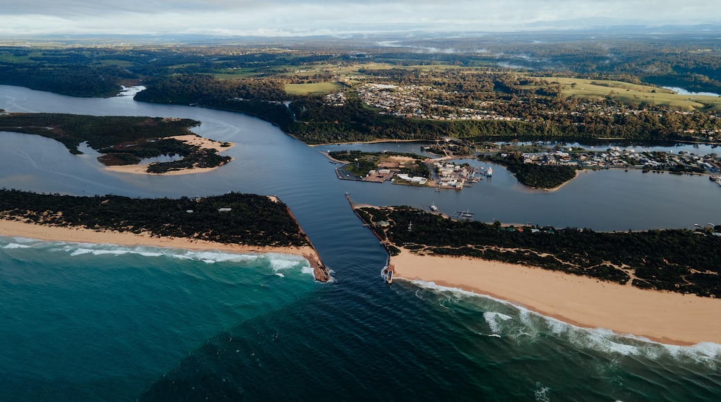 The Entrance at Lakes Entrance Victoria Australia showing warning signs in the channel for boating