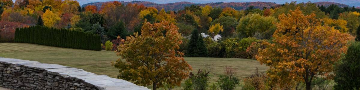 view of fall foliage and Adirondack Mountains in New York from Overlook Park in South Burlington, Vermont