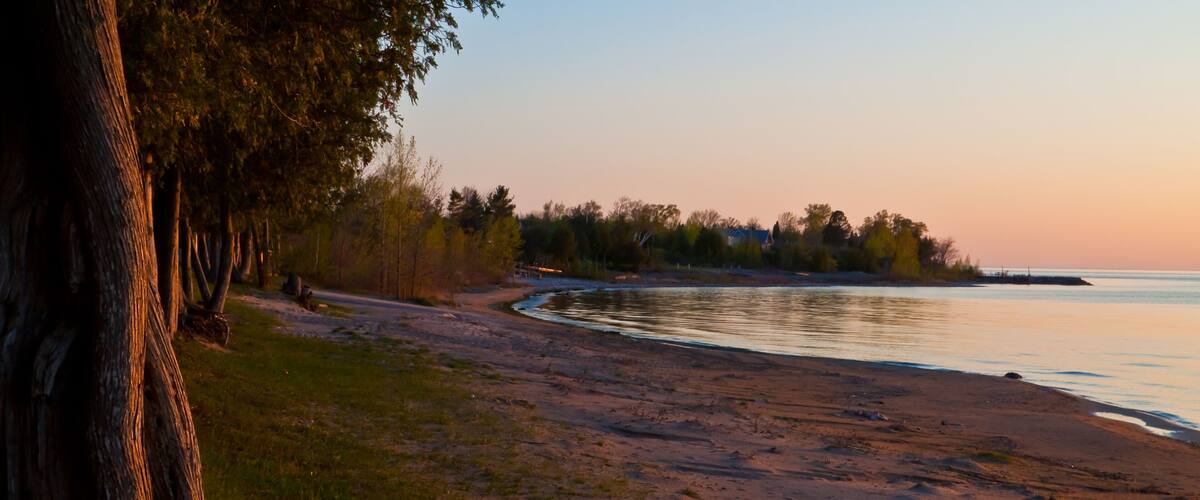 Sunset on Cedar Trees on Sand Beach Along Green Bay, Frank E. Murphy County Park, Egg Harbor, Wisconsin, USA