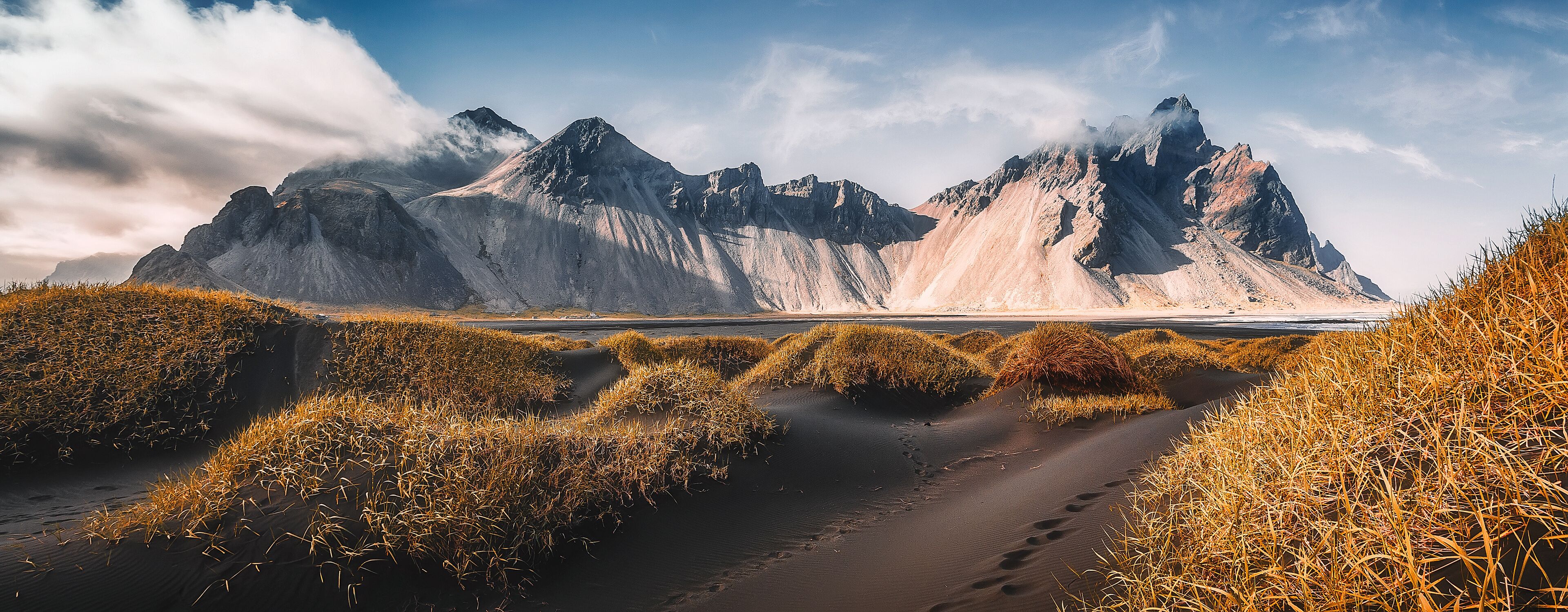 Vestrahorn mountaine on Stokksnes cape in Iceland during sunset. Amazing Iceland nature seascape. popular tourist attraction. Best famouse travel locations. Scenic Image of Iceland