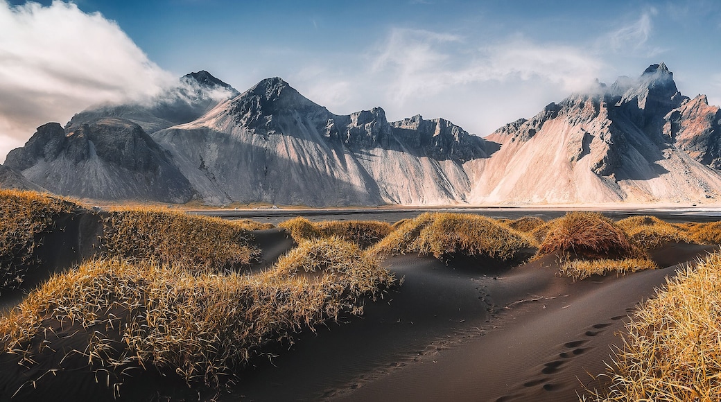 Vestrahorn mountaine on Stokksnes cape in Iceland during sunset. Amazing Iceland nature seascape. popular tourist attraction. Best famouse travel locations. Scenic Image of Iceland