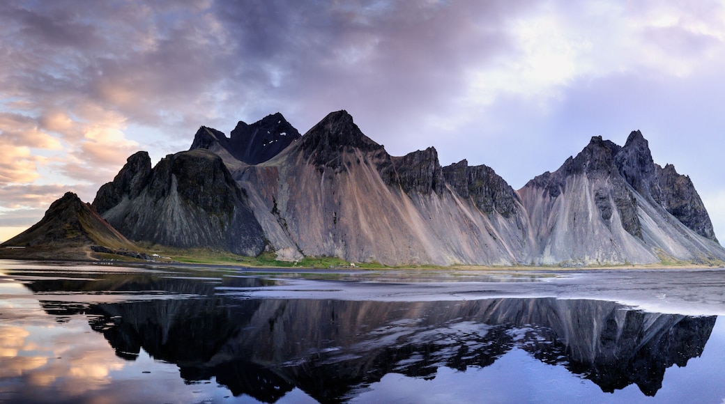 Sand dunes on the Stokksnes on southeastern Icelandic coast with Vestrahorn (Batman Mountain). Iceland, Europe.