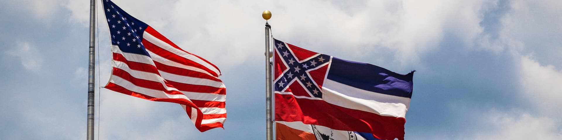 Flags of the United States, State of Mississippi and City of Brandon, MS waving in the wind