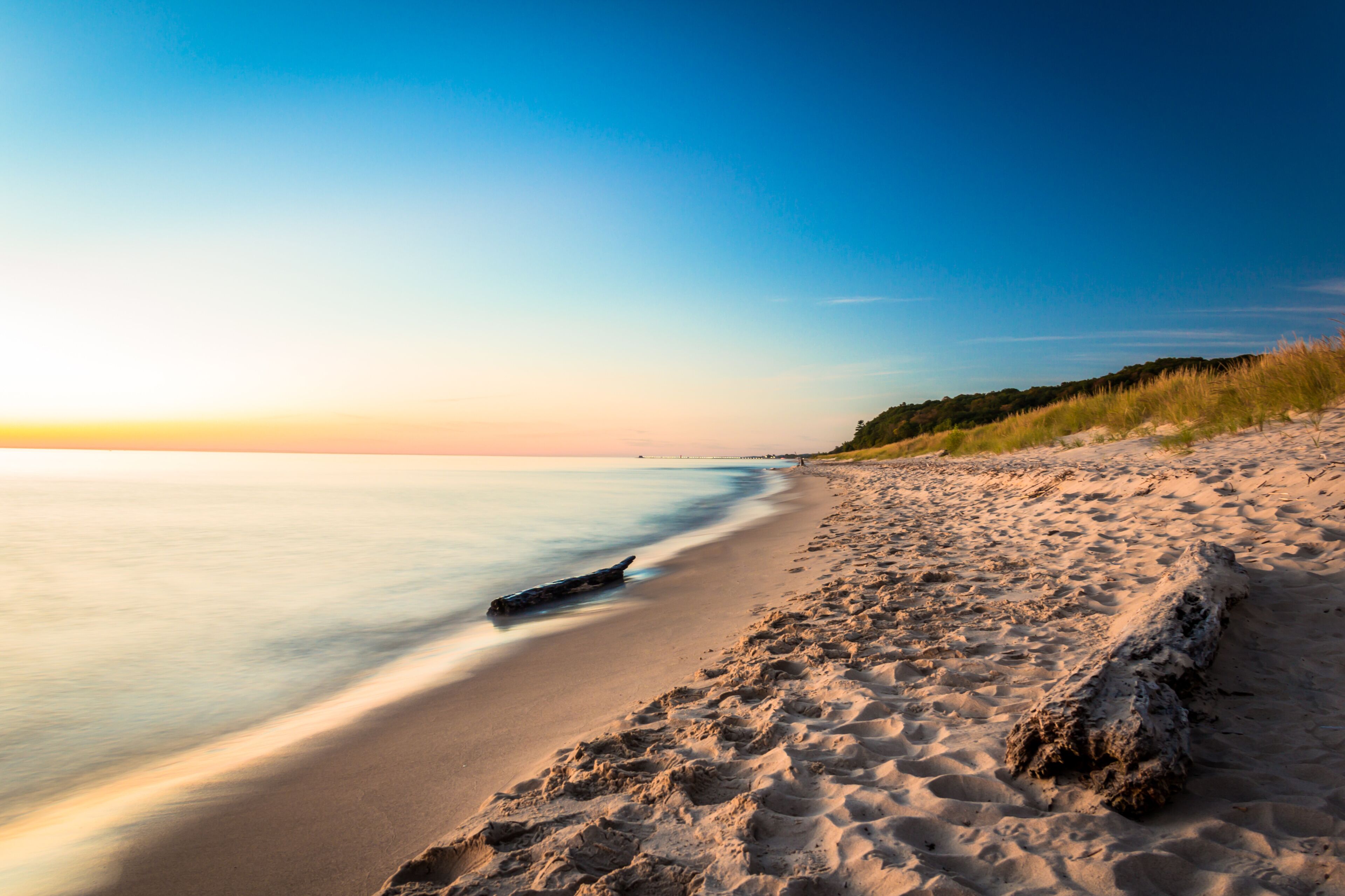 Lake Michigan Pastels. Glowing Beach at Sunset. Natural Beauty Background with Copy Space.