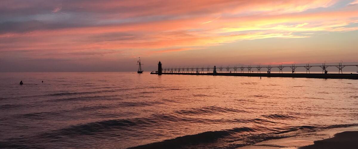 The #sunsets in South Haven MI are so beautiful! All the colors and feels!! #beach #summer #lighthouse #michigan