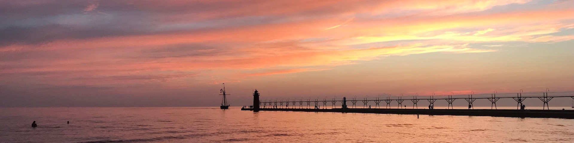 The #sunsets in South Haven MI are so beautiful! All the colors and feels!! #beach #summer #lighthouse #michigan