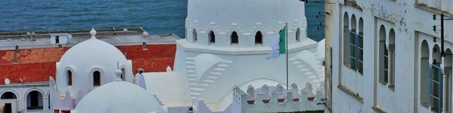 April 2011
Medresa Thaalibiya, Algiers
This fine medresa and mosque was built in 1904 by French architect Henry Petit in beautiful harmonic neo-moorish style. It is named after marabout (patron saint of the city) Sidi Abd-er- rahman-et-Thalbi (1387-1471), hence the Thaalibiya name. It has served as a school of islamic law, general islamic school for muslim children and as a mosque.
The view with the sea and white multistoreyed appartement houses with blue windows is the essence of Algiers to me.