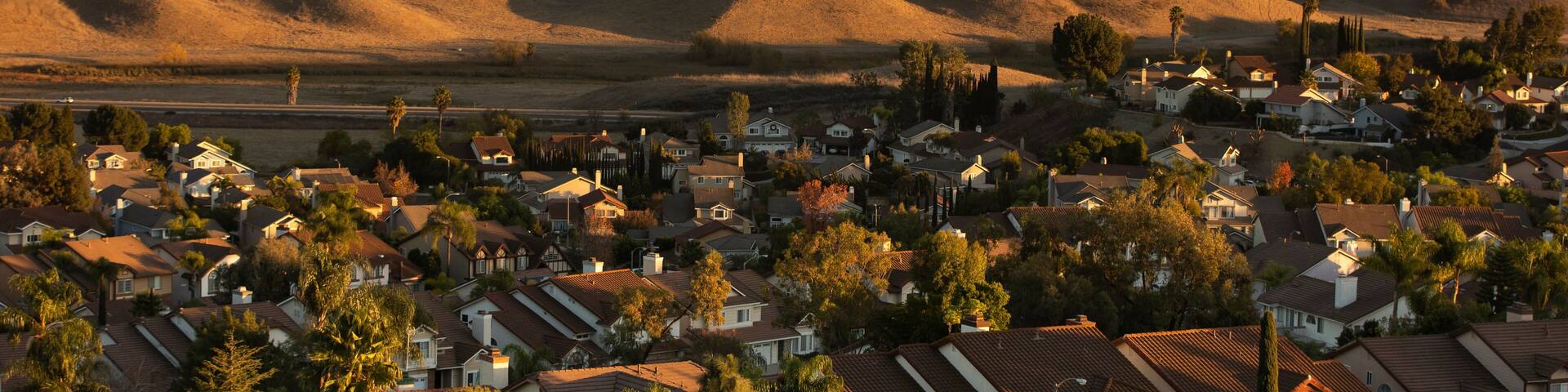 Sunset view of a suburban neighborhood in Diamond Bar, California, USA, with the Chino Hills in the background.