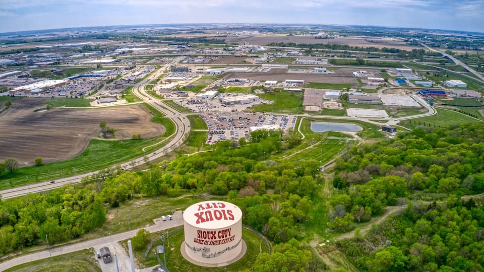 An aerial view of Sioux City with a large circular landmark in the center.
