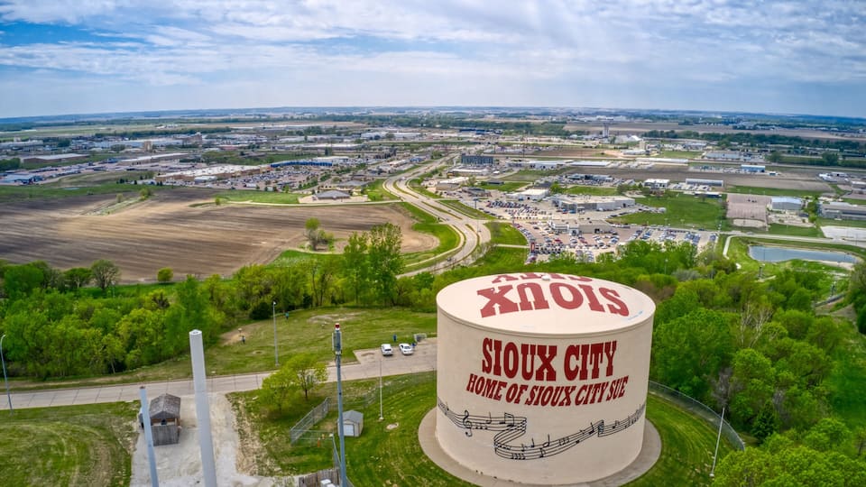 A large silo labeled "Sioux City" with a cityscape in the background.