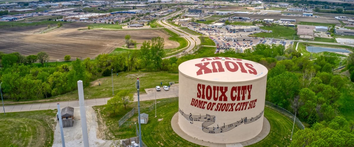 A large silo labeled "Sioux City" with a cityscape in the background.