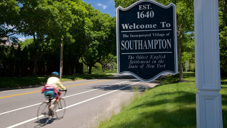 A welcome sign for the village of Southampton, established in 1640, with a cyclist on the road.