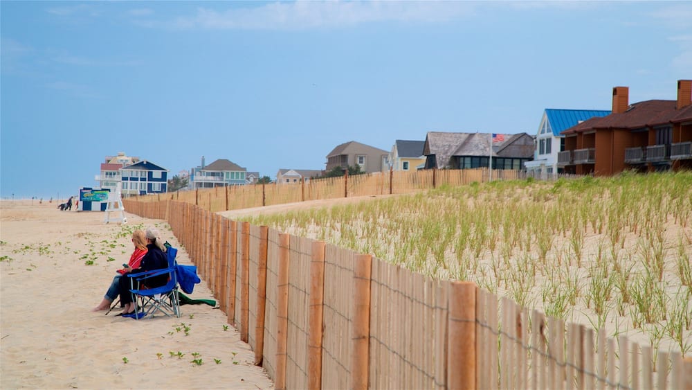 Dewey Beach showing general coastal views and a sandy beach as well as a couple