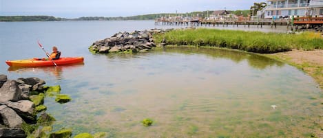 Dewey Beach showing kayaking or canoeing and general coastal views as well as an individual child