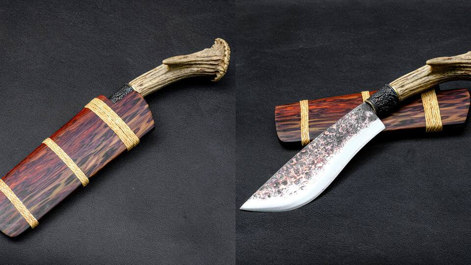Two wooden knives with handles wrapped in rope, placed on a dark surface.