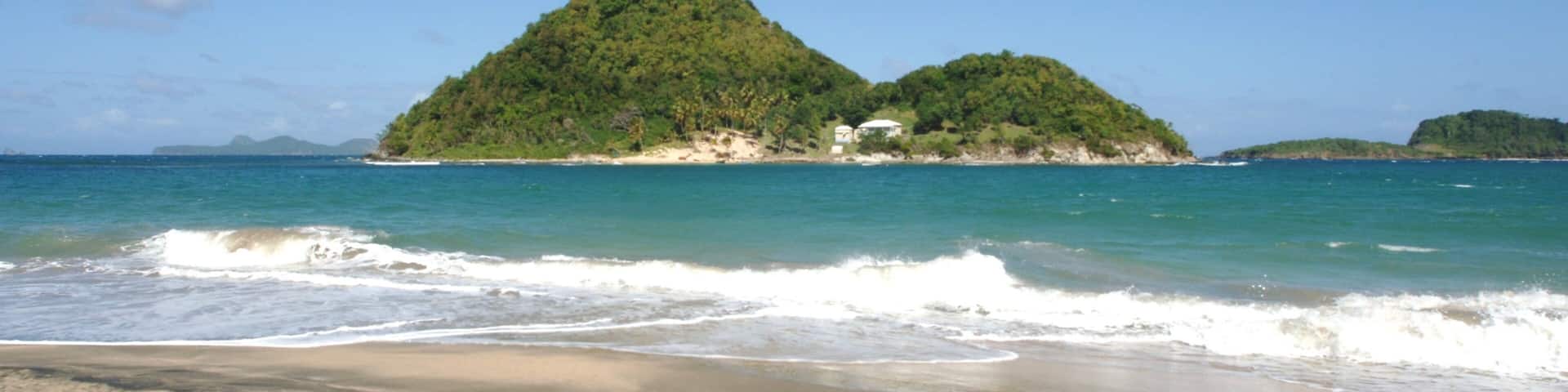 Grenada showing a beach and island views