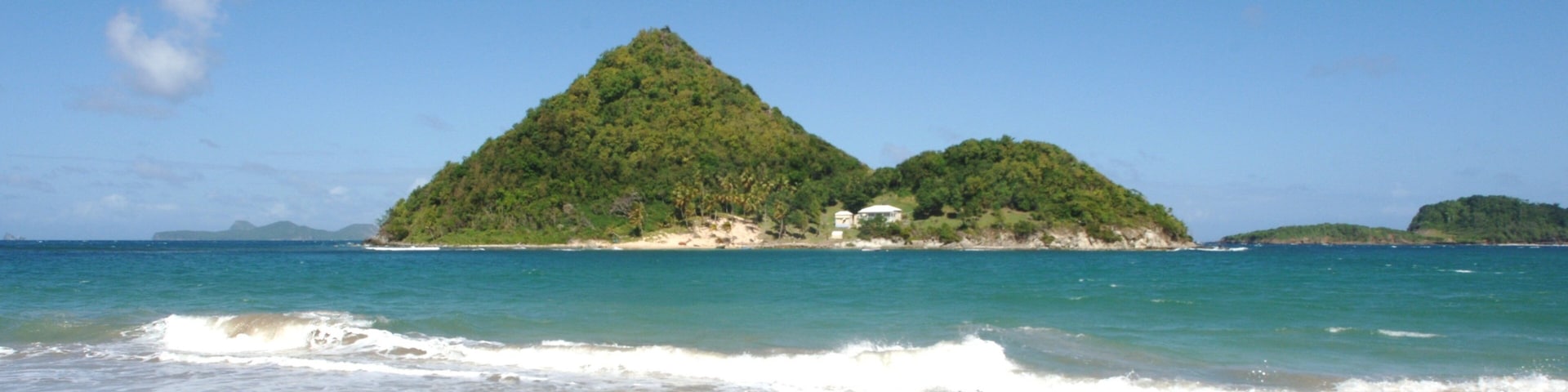Grenada showing a beach and island views