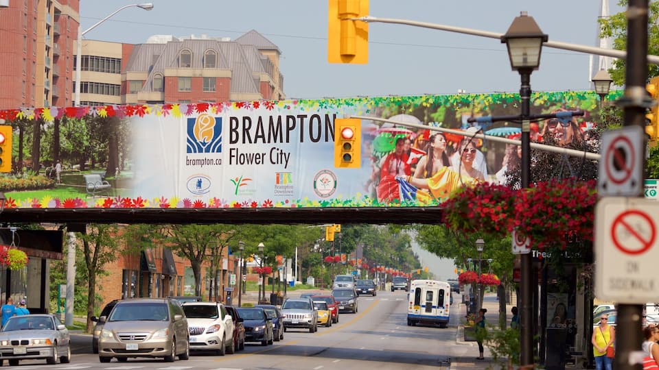 A street with a banner reading "Brampton Flower City" and a bus in the background.