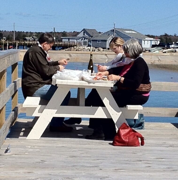 Now this is dedication! Some tourists enjoying fresh lobsters, steamers, and wine on the deck of the lobster pound...and it's 50*s out,brrrrr!