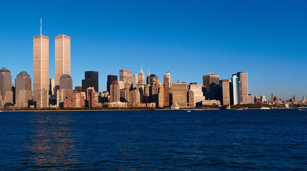 Panoramic view of lower Manhattan and Hudson River, New York City skyline, NY with World Trade Towers at sunset