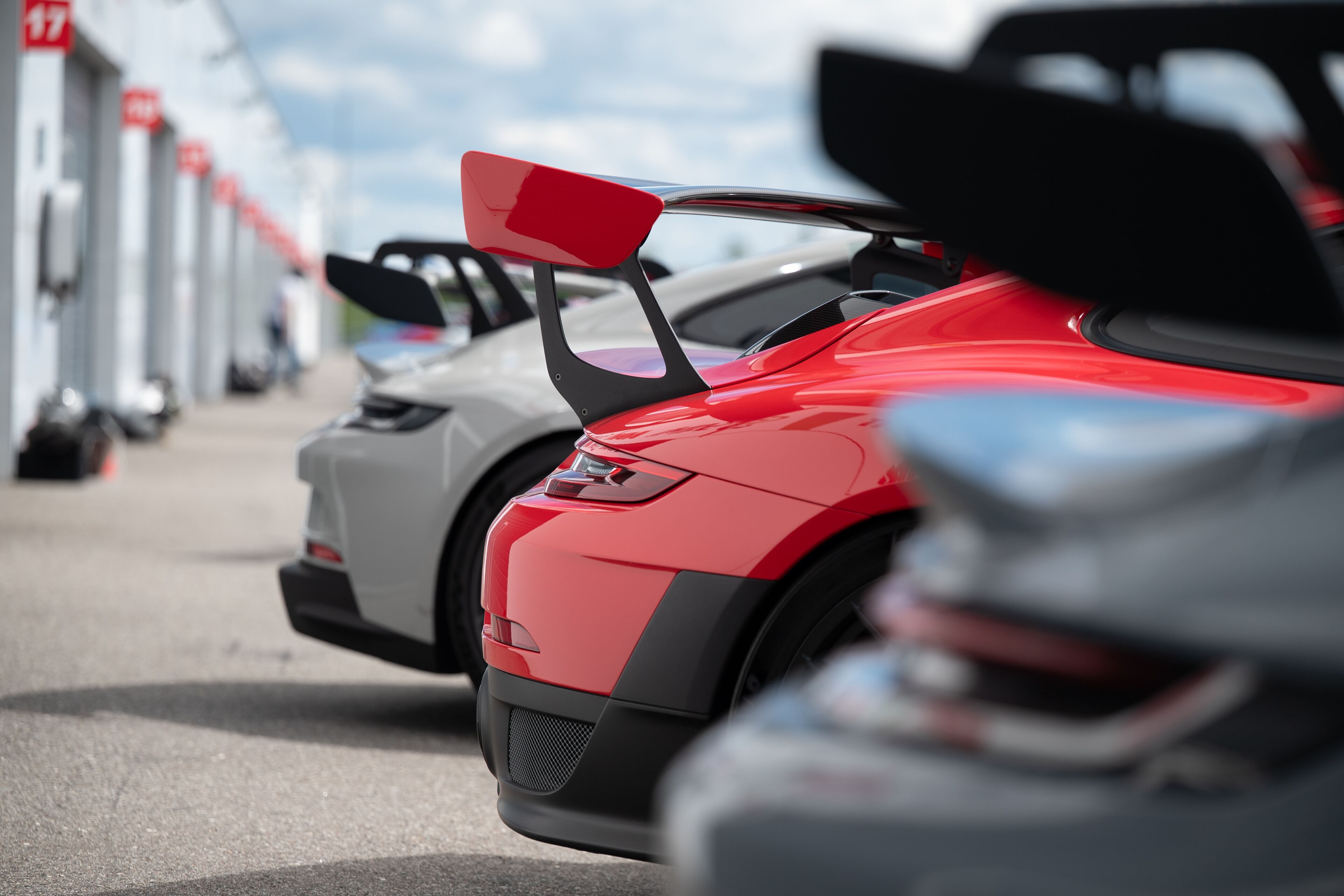 High-performance sport cars aligned at racing track