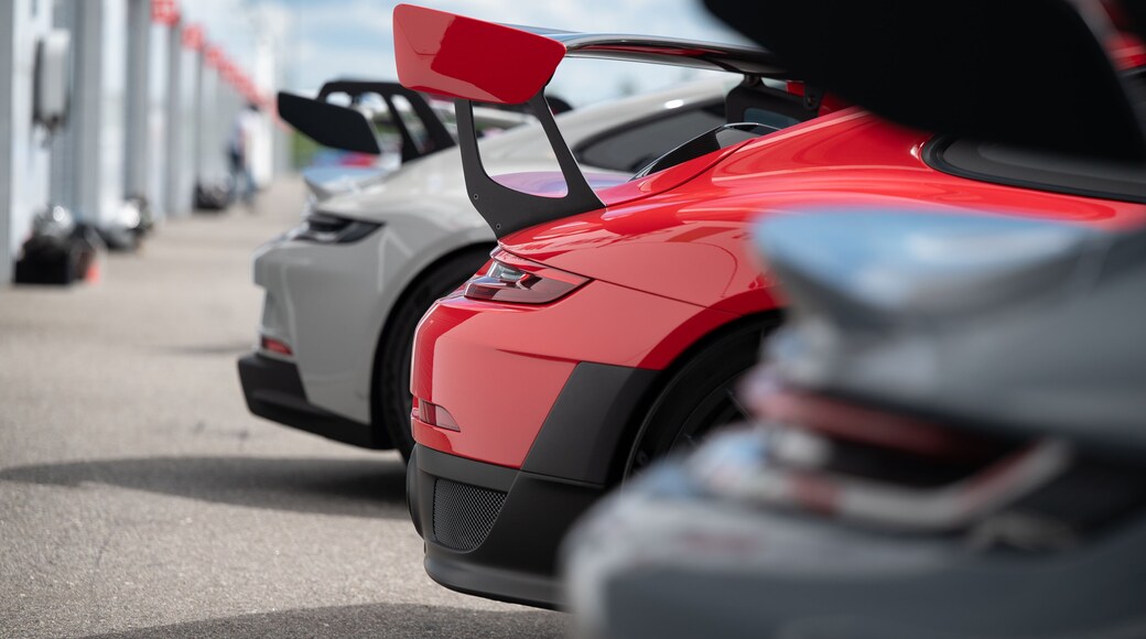 High-performance sport cars aligned at racing track