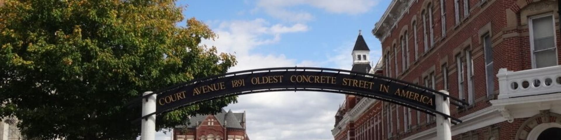 The oldest concrete street in America can be found in Bellfontaine, Ohio. In 1891, Bellefontaine became the location of the first concrete street in America. George Bartholomew invented a process for paving using Portland cement, which until then had been used in stone construction. A small section of Main Street, on the west side of the Logan County Courthouse, was the first to be paved using that process. When that proved successful, Court Avenue, which runs along the south side of the courthouse, was then paved. While Main Street is now paved with asphalt, Court Avenue has retained its original concrete pavement for over 100 years. At its centennial, the street was closed and a statue of Bartholomew placed at its Main Street end, although since then one lane has been reopened for eastbound traffic.