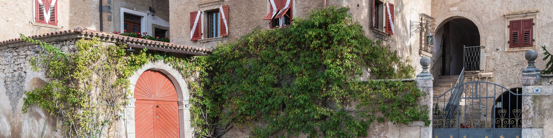 The medieval Casez Castle (or Palazzo Concini) XV century - details of the facade, Sanzeno, Non valley, Trento province, Trentino Alto-Adige, Italy, Europe - November 12, 2022