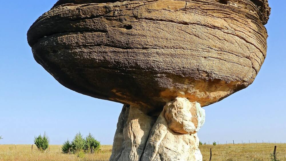 a eroded mushroom rock formation in the roadside attraction of mushroom rock state park, near salina, in north central kansas