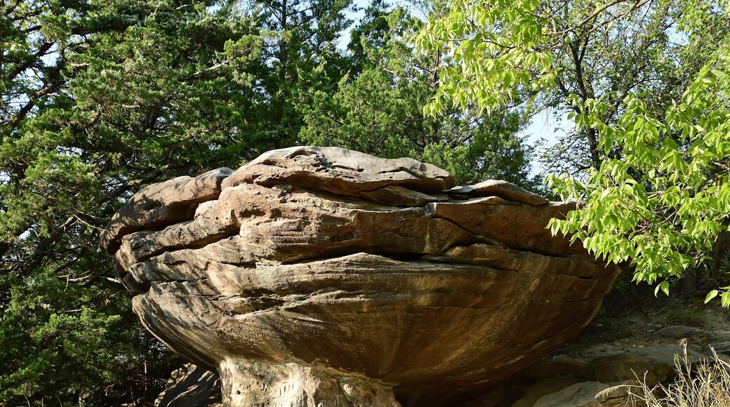 eroded mushroom rock formation in the roadside attraction of mushroom rock state park, near salina, in north central kansas