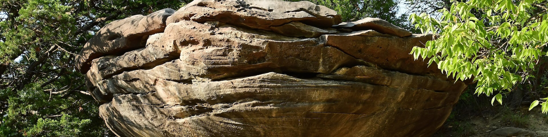 eroded mushroom rock formation in the roadside attraction of mushroom rock state park, near salina, in north central kansas