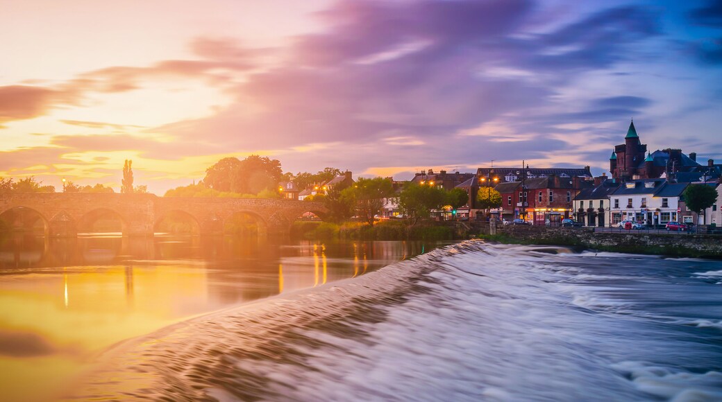 The River Nith and old bridge at sunset in Dumfries, Scotland, UK.