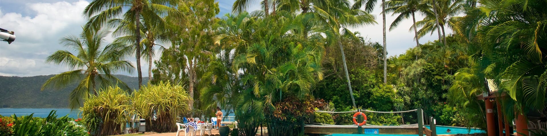 Daydream Island which includes a luxury hotel or resort, a pool and swimming