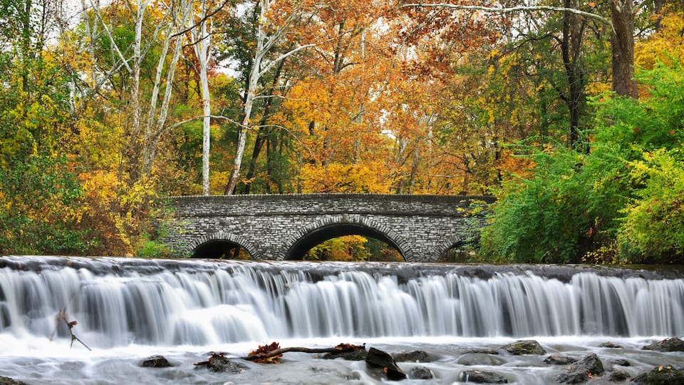 Stone Bridge And Waterfall