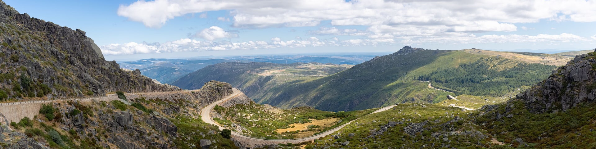 View from the top of the mountains of the Serra da Estrela natural park, Star Mountain Range, road and glacier valley, Portugal