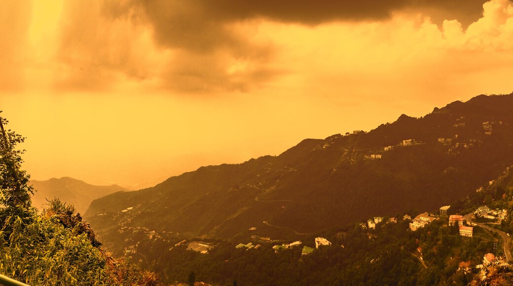 stormy landscape view of Mussoorie or Mussouri hill top peak city located in Uttarakhand India with colorful buildings