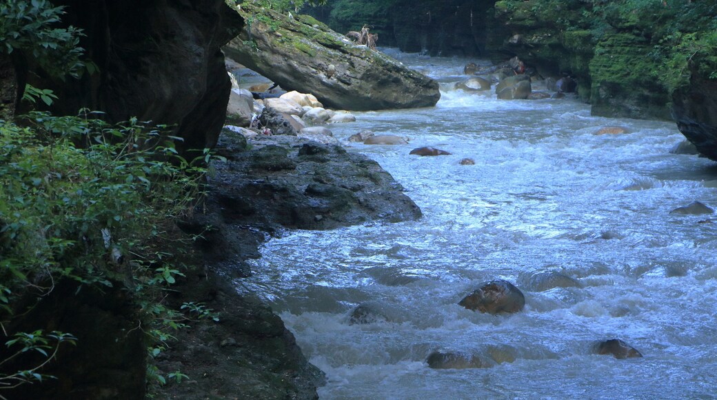 Beautiful views of the flowing river at Tapkeshwar Temple in Dehradun from different angles.