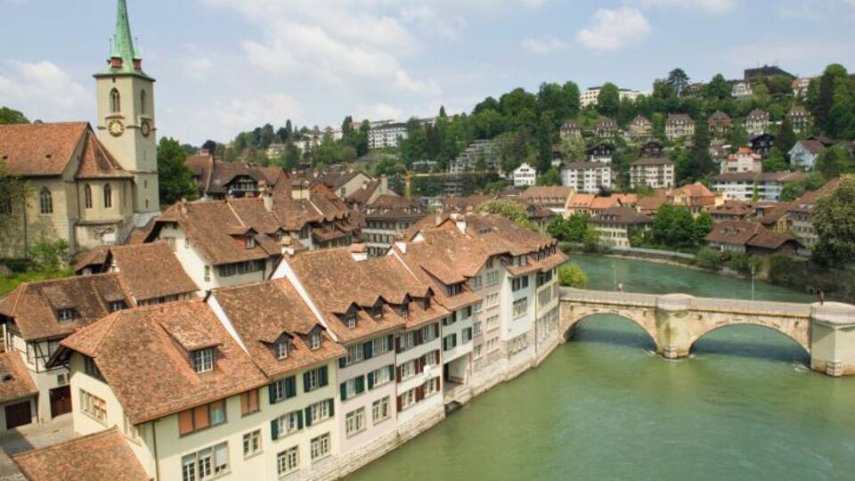Switzerland, Old City of Bern, Buildings and bridge along Aare River