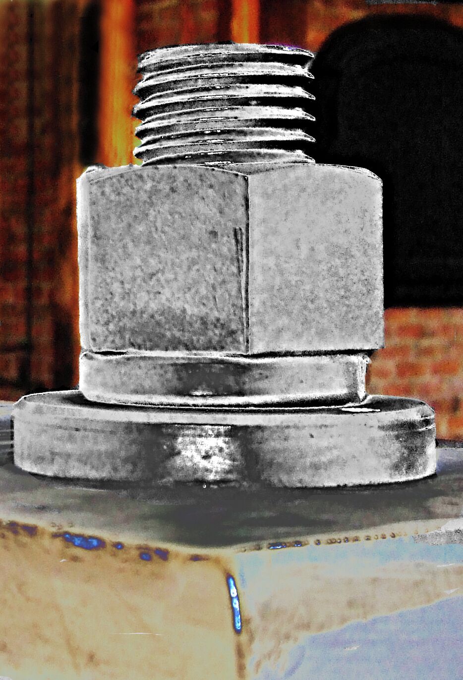 Found in one of the villages historic shops. A truly huge nut and stud. I don't think this is a one person job to tighten the nut. The required wrench must be gigantic.