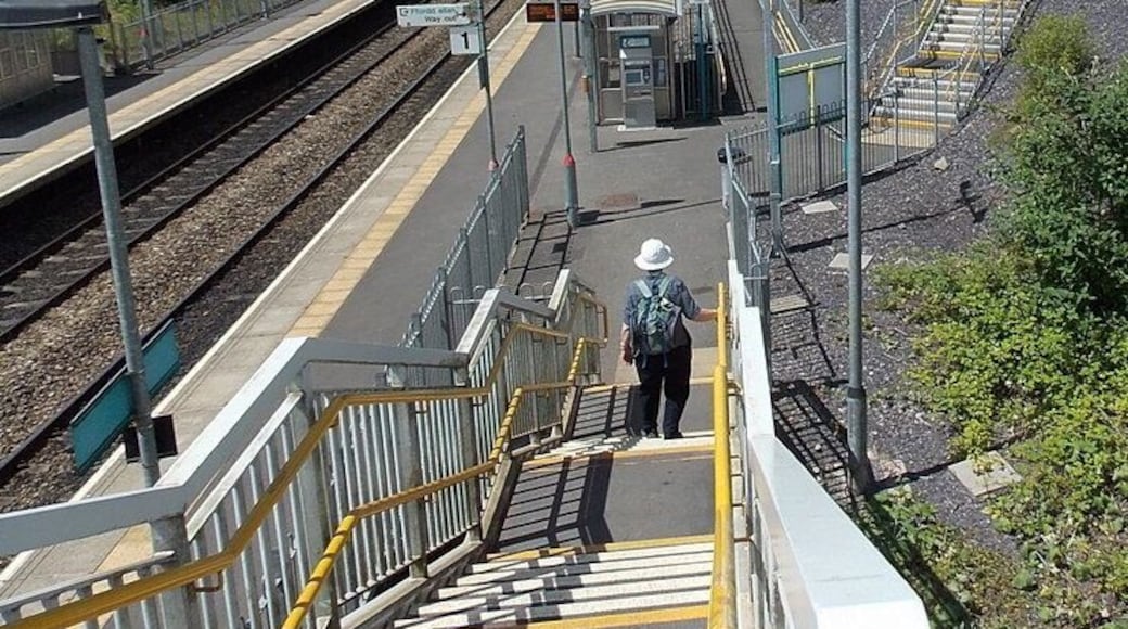 Steps or ramp access, platform 1, Llanharan railway station Those unable or unwilling to use the steps can use the ramps on the slope on the north side of the station. Access to and from platform 2 is on flat land on the south side.